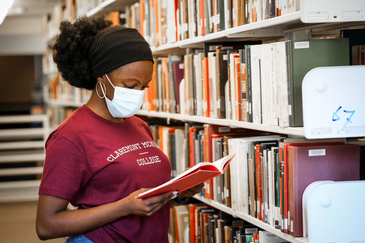 Student reading book in the Library.